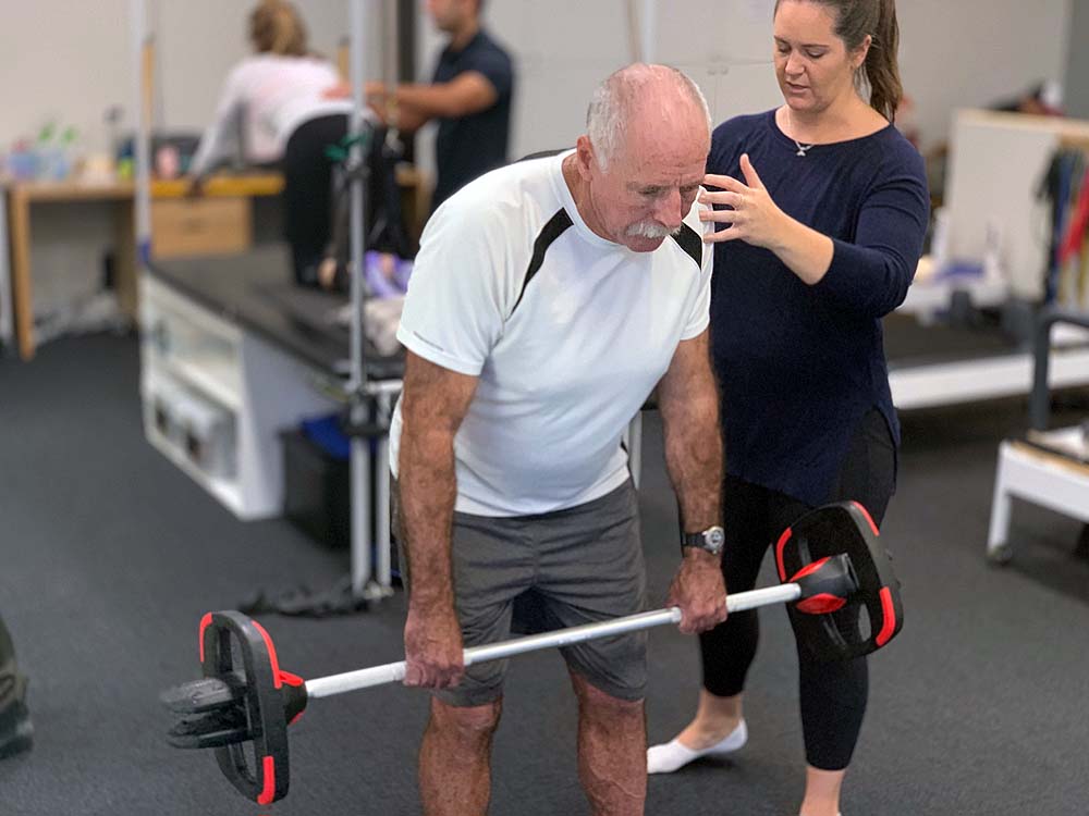 Man exercising and engaging in general activity with a coach 